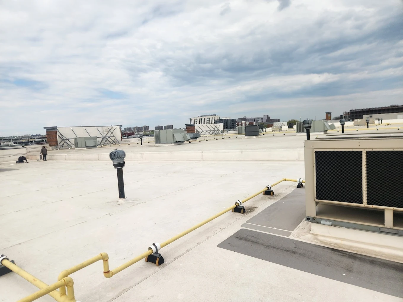 All-Star Roofing Inc. completing commercial flat roof project in Amityville, Long Island — rubber membrane installation